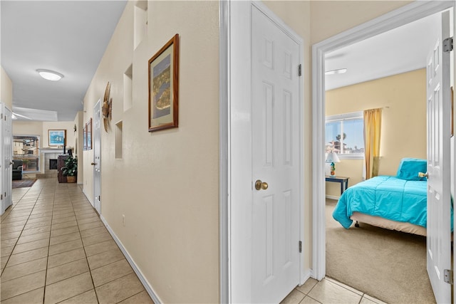 corridor with light tile patterned flooring