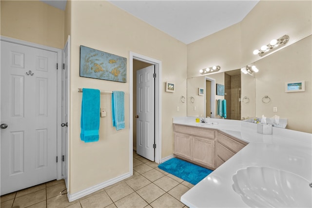 bathroom featuring tile patterned flooring and vanity