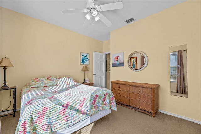 bedroom featuring ceiling fan and light carpet