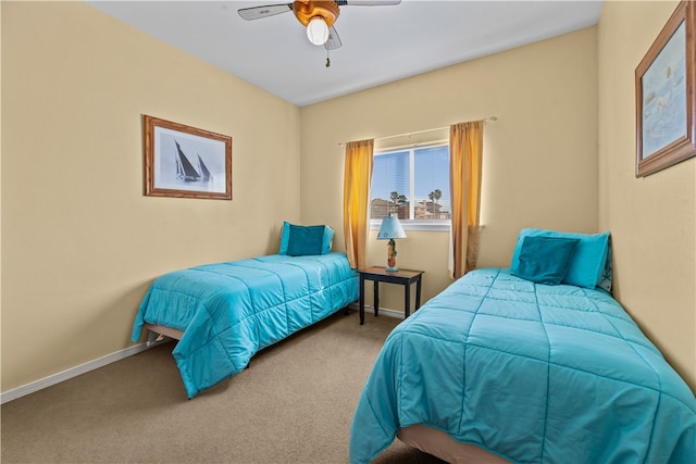 bedroom with ceiling fan and carpet flooring