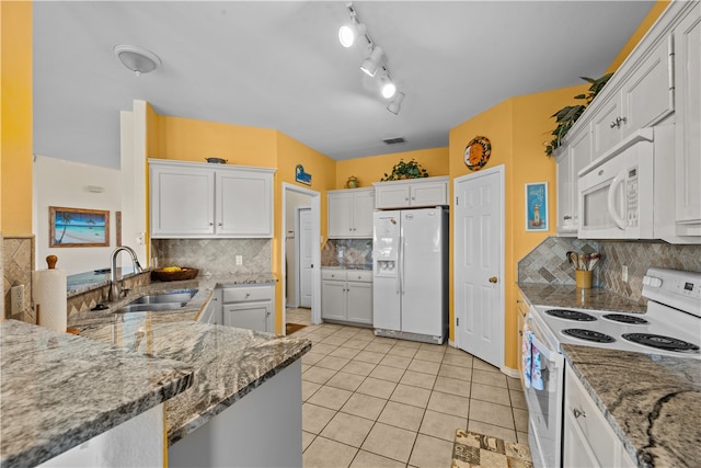 kitchen with white cabinets, decorative backsplash, sink, and white appliances