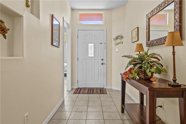 foyer with light tile patterned floors