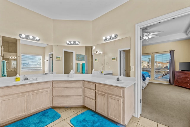 bathroom featuring ceiling fan, tile patterned flooring, and plenty of natural light