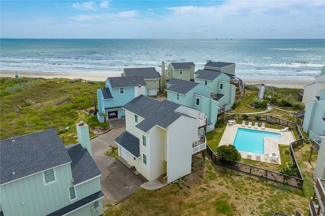 birds eye view of property featuring a water view and a view of the beach