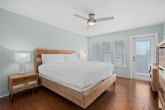 bedroom with ceiling fan, dark hardwood / wood-style floors, and access to outside