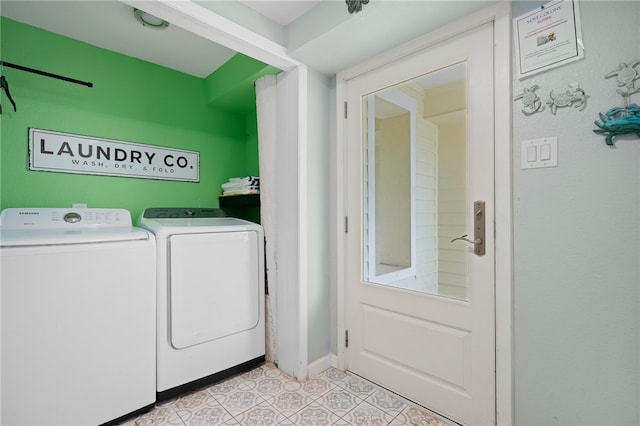 clothes washing area featuring light tile patterned floors and independent washer and dryer