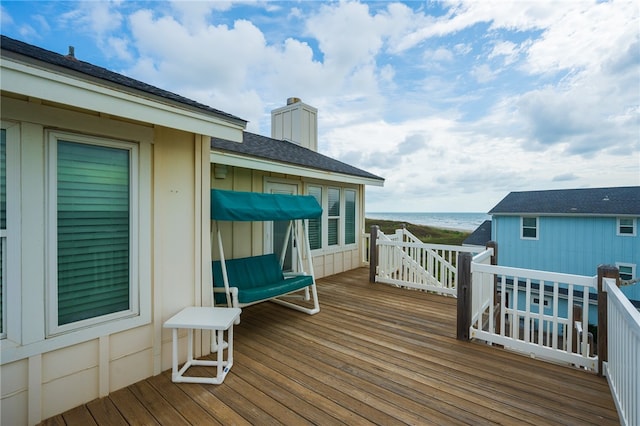 wooden deck featuring a water view