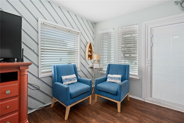 sitting room with dark hardwood / wood-style flooring