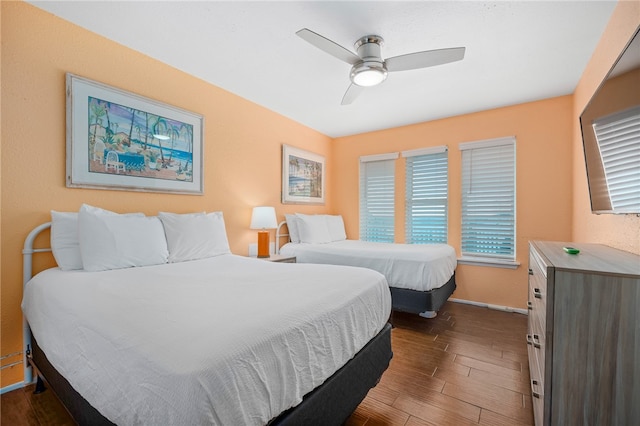 bedroom featuring ceiling fan and dark hardwood / wood-style floors