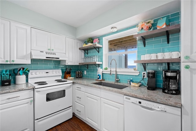 kitchen featuring decorative backsplash, white cabinetry, white appliances, and sink