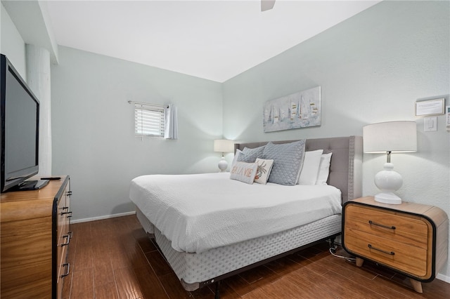 bedroom with dark wood-type flooring and ceiling fan