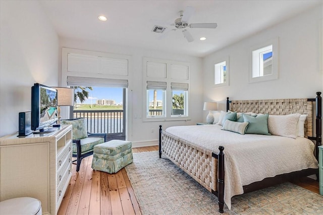 bedroom featuring light wood-type flooring, ceiling fan, and access to exterior