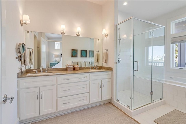 bathroom with vanity, tile patterned flooring, and shower with separate bathtub