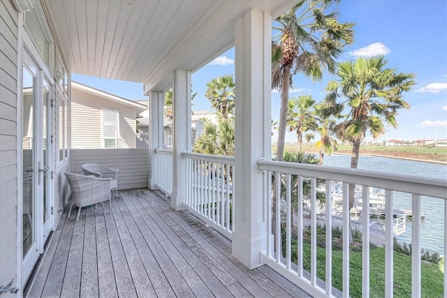 wooden deck with a water view