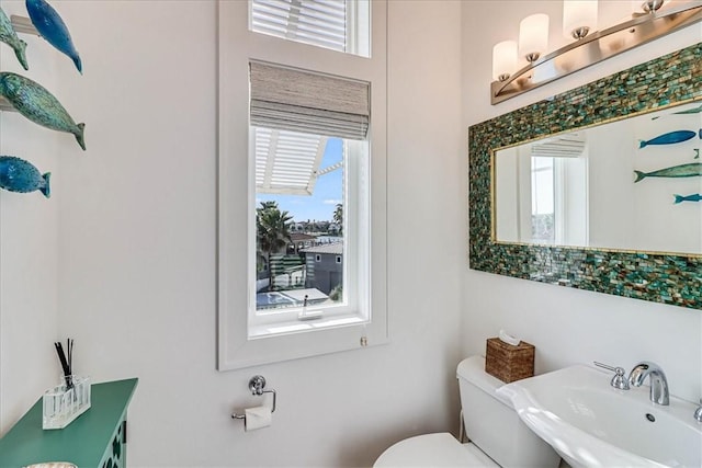 bathroom featuring toilet and sink