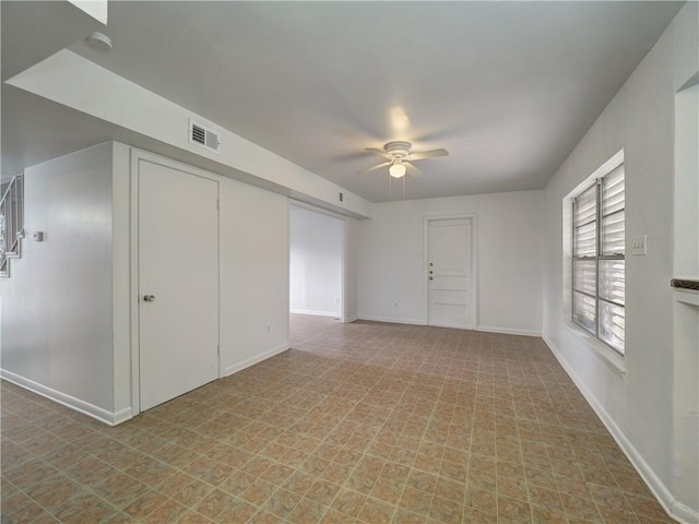 unfurnished room with ceiling fan