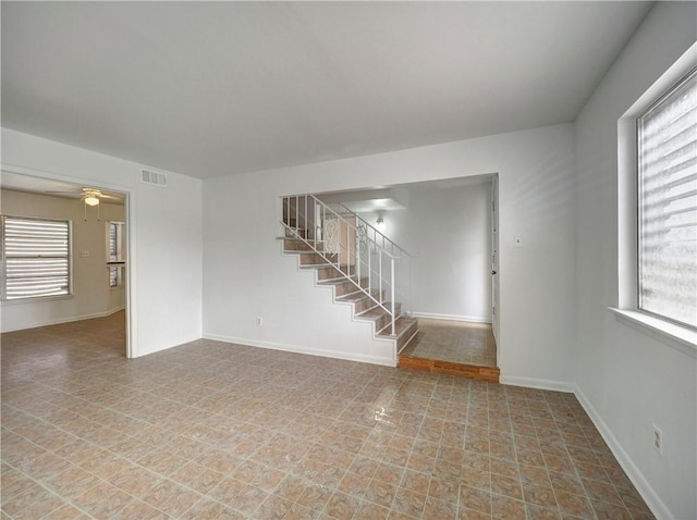 unfurnished room featuring ceiling fan