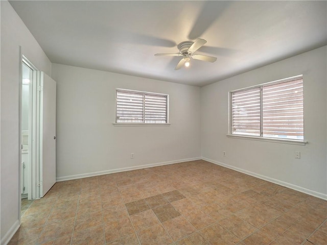 unfurnished room with ceiling fan