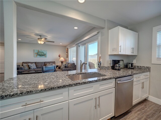 kitchen featuring dishwasher, hardwood / wood-style floors, white cabinets, sink, and ceiling fan