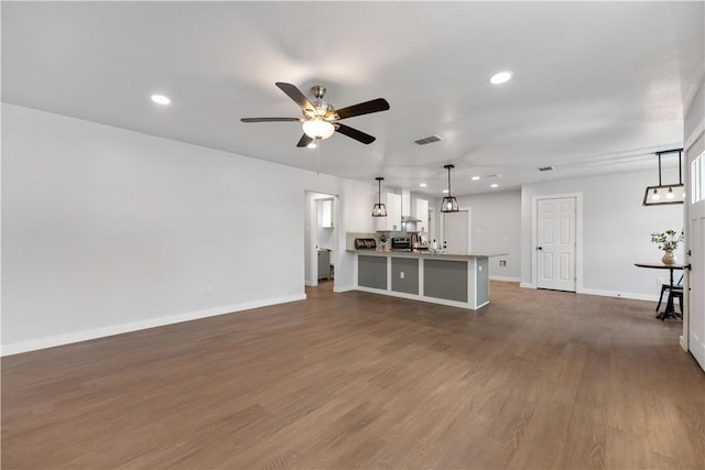 2809 Tarlton St, Corpus Christi, TX 78405 - unfurnished living room featuring recessed lighting, a ceiling fan, and dark wood-style flooring