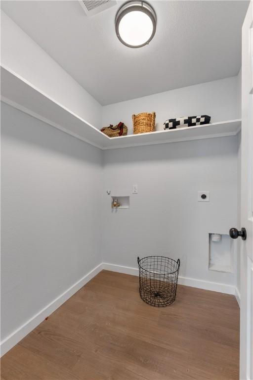 2809 Tarlton St, Corpus Christi, TX 78405 - laundry room featuring hookup for a washing machine, electric dryer hookup, and wood finished floors