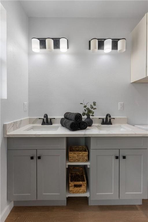 2809 Tarlton St, Corpus Christi, TX 78405 - bathroom with double vanity and wood finished floors