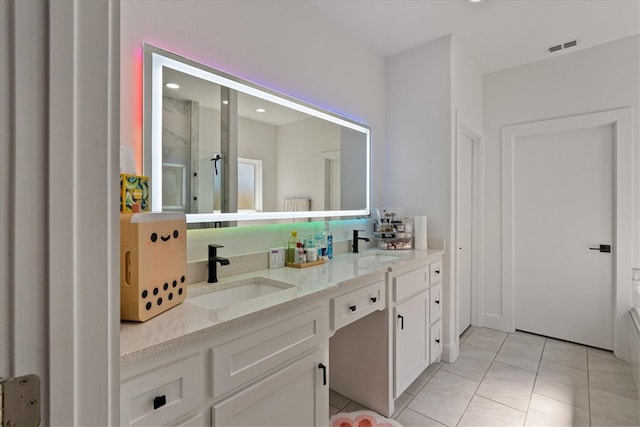 bathroom with vanity and tile patterned floors