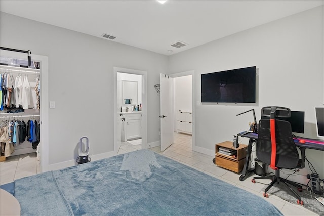 tiled bedroom featuring a closet