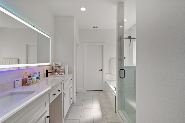 bathroom featuring vanity, plus walk in shower, and tile patterned floors