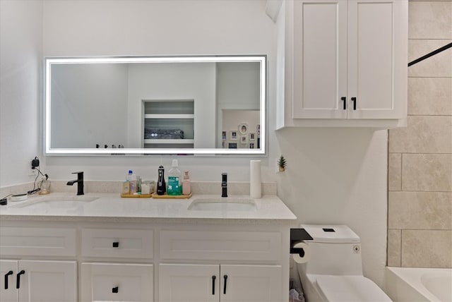 bathroom with vanity and toilet