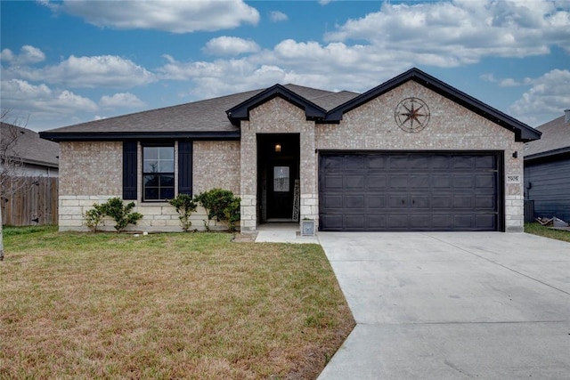 view of front of home featuring a garage and a front yard