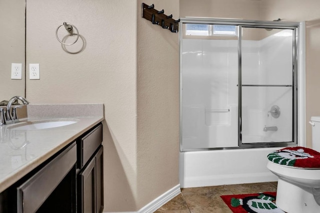 full bathroom featuring toilet, vanity, and combined bath / shower with glass door