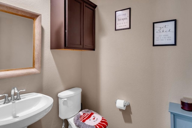 bathroom with sink and toilet