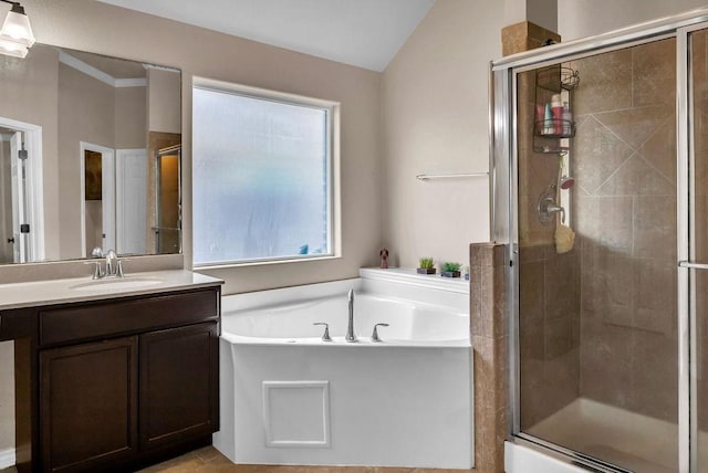 bathroom featuring vanity, separate shower and tub, and lofted ceiling