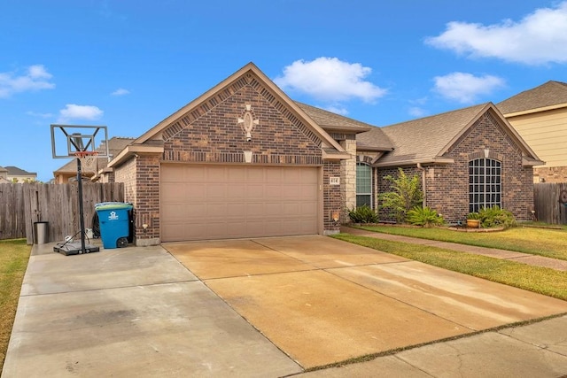 view of front of home featuring a garage and a front lawn