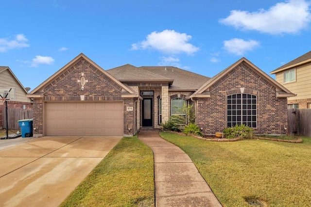 view of front of property with a garage and a front lawn