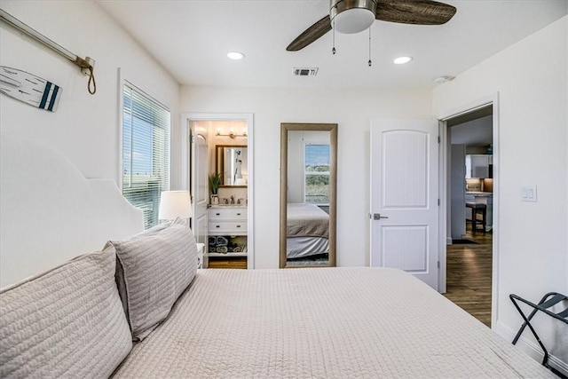 bedroom with a ceiling fan, wood finished floors, visible vents, recessed lighting, and ensuite bathroom