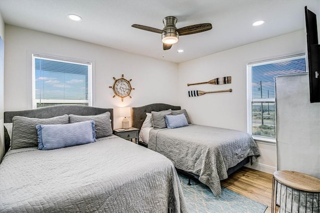 bedroom with recessed lighting, baseboards, wood finished floors, and a ceiling fan