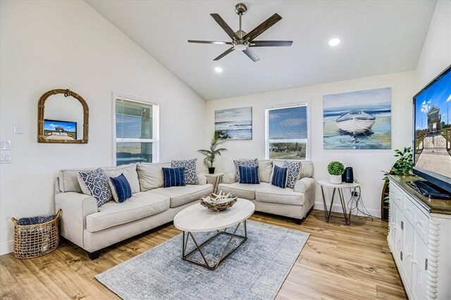 living room with high vaulted ceiling, light wood-style flooring, a ceiling fan, recessed lighting, and baseboards