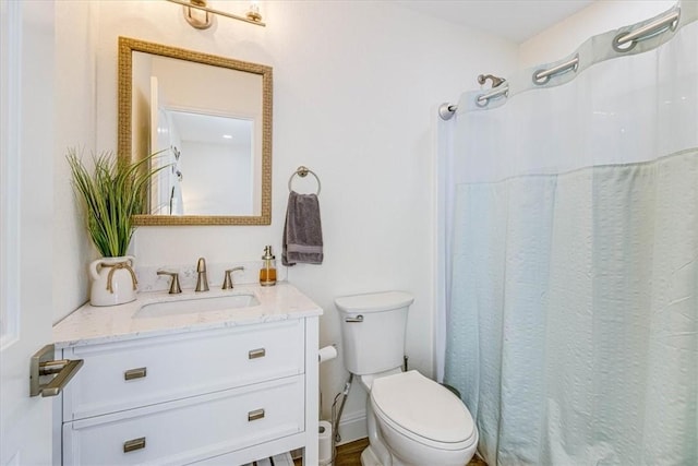 full bathroom with vanity and toilet