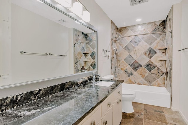 12308 Up River Rd, Corpus Christi, TX 78410 - bathroom featuring toilet, stone tile flooring, vanity, shower / bath combination, and baseboards