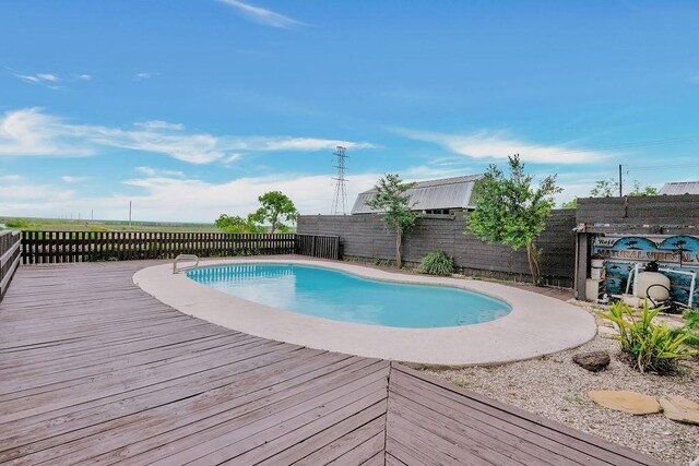 12308 Up River Rd, Corpus Christi, TX 78410 - view of swimming pool with a wooden deck and a fenced backyard