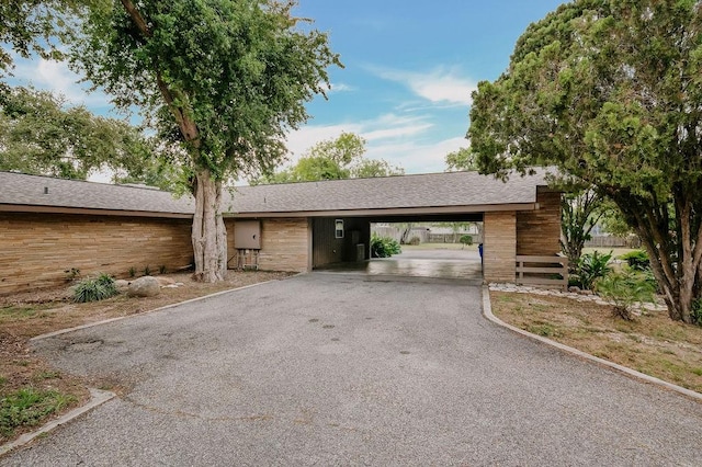12308 Up River Rd, Corpus Christi, TX 78410 - view of front of property featuring driveway, a carport, and stairway