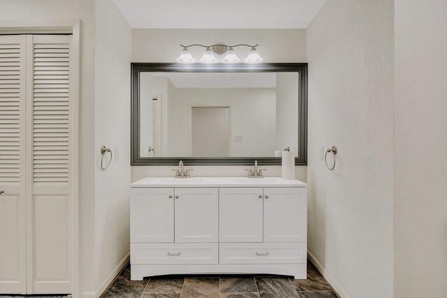 12308 Up River Rd, Corpus Christi, TX 78410 - full bath with baseboards, a closet, and double vanity