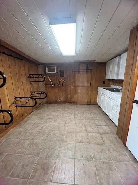 12308 Up River Rd, Corpus Christi, TX 78410 - finished below grade area with wood walls, a sink, and a wall mounted air conditioner