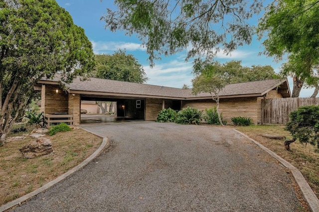 12308 Up River Rd, Corpus Christi, TX 78410 - single story home featuring asphalt driveway, fence, and a carport