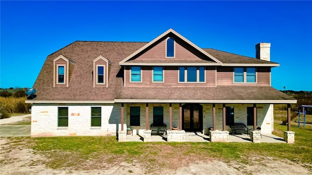 rear view of house featuring a patio