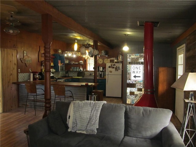 119 Horse Shoe Clf, Sandia, TX 78383 - living area with wood finished floors, wooden walls, and beam ceiling