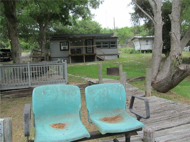 119 Horse Shoe Clf, Sandia, TX 78383 - back of house with a wooden deck, stairway, and a yard