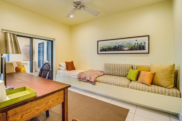 bedroom featuring light tile patterned floors, a ceiling fan, and access to exterior